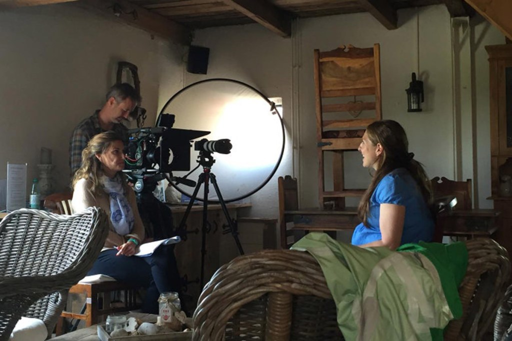 woman being interviewed by tv crew