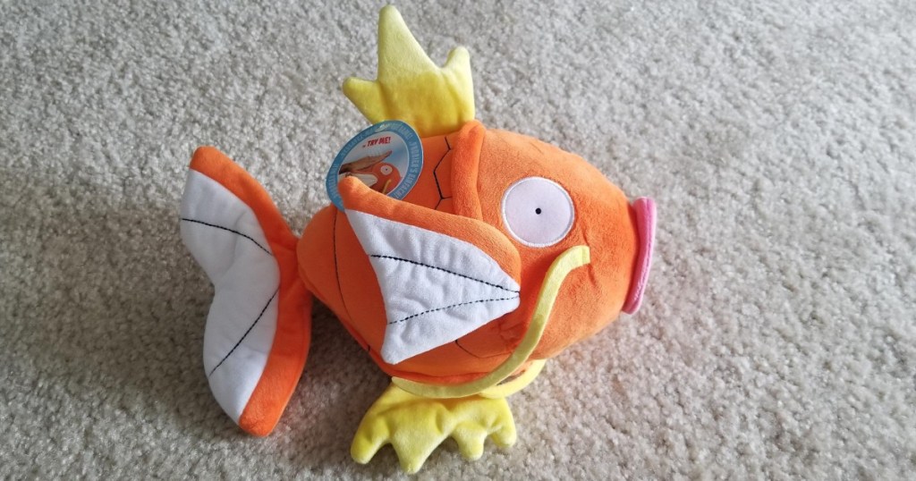 colorful fish plush on white carpet
