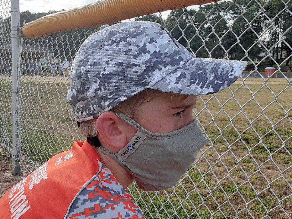 boy wearing gray face mask