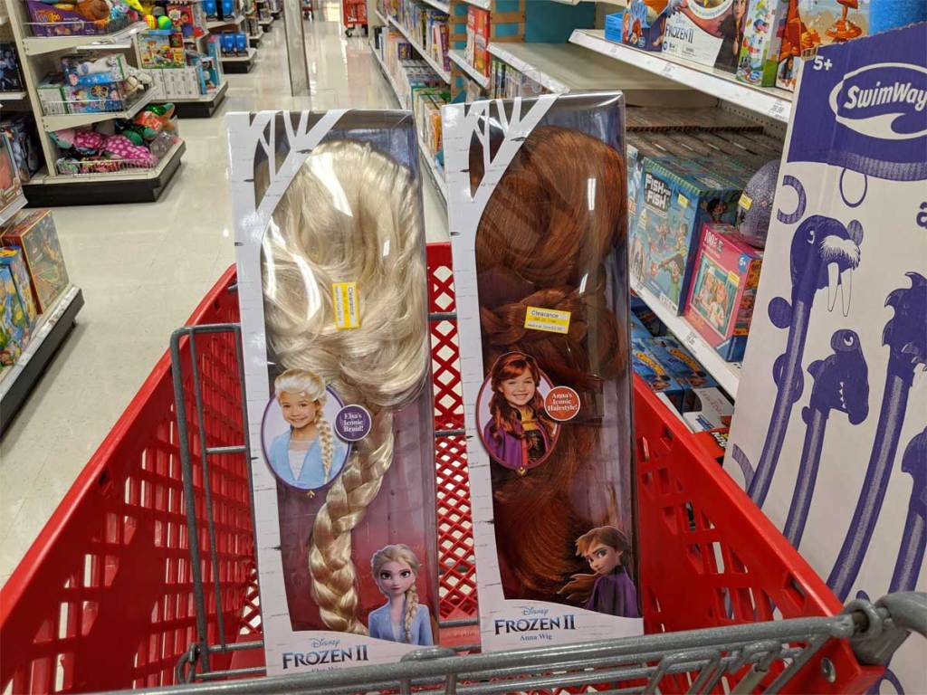 two doll wigs in a shopping cart