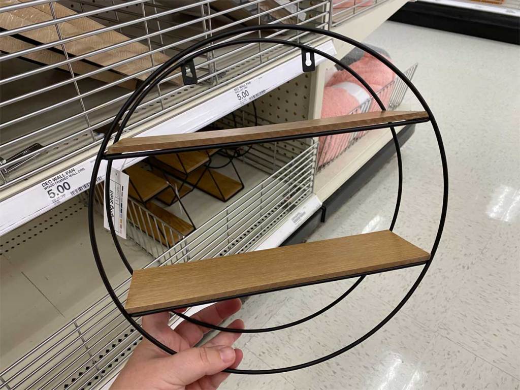 hand holding wood and wire shelf