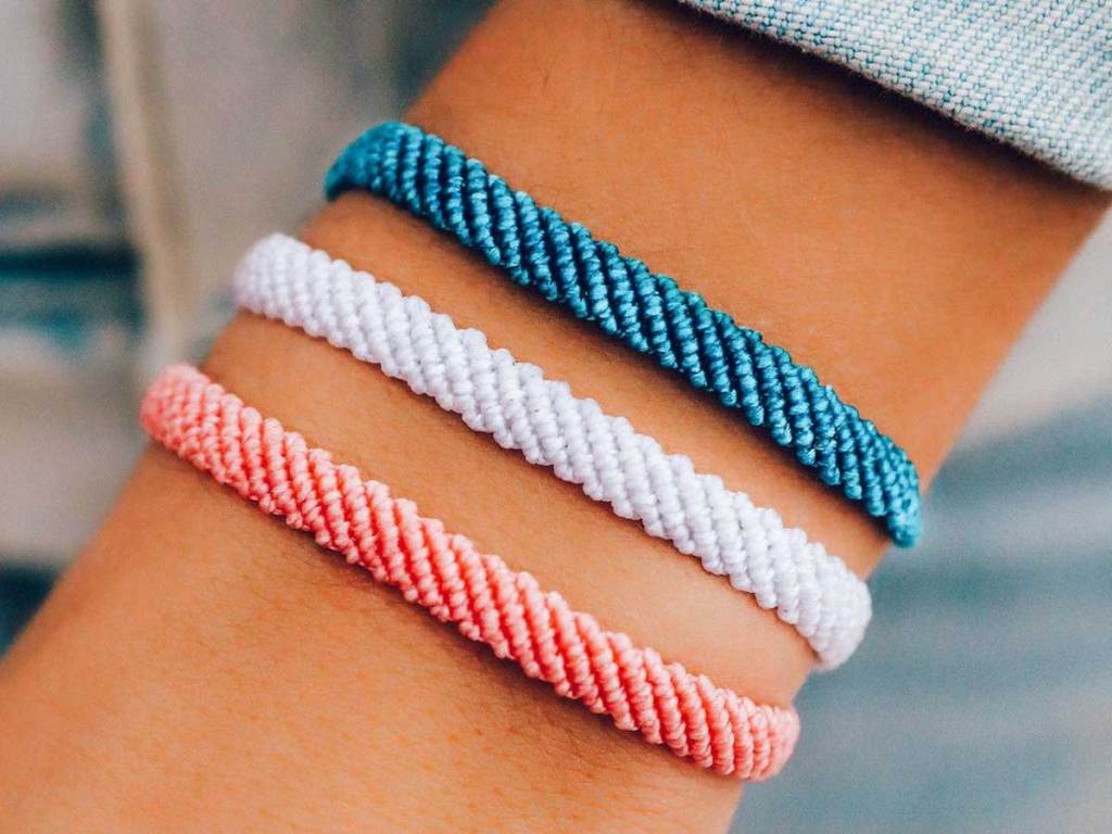 woven bracelets in three colors on wrist