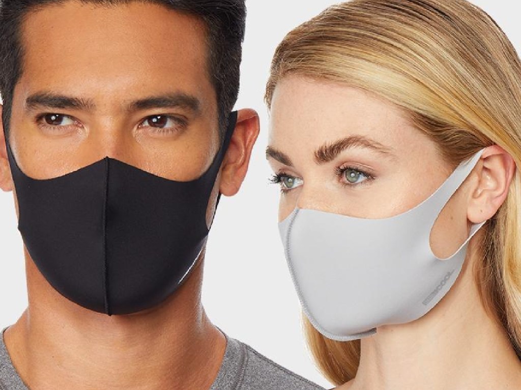 a man and a woman wearing reusable face masks