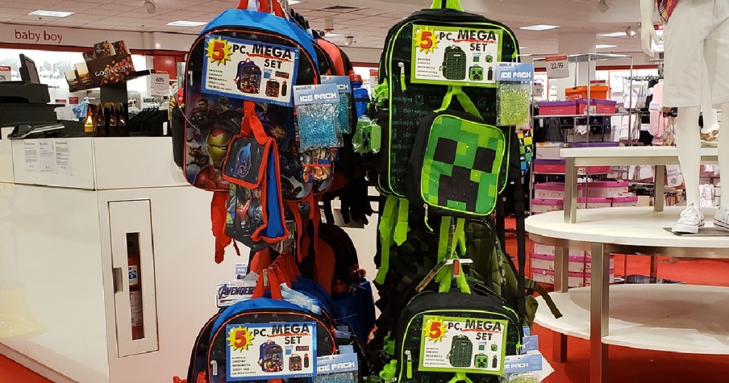 kids character backpack sets hanging in store