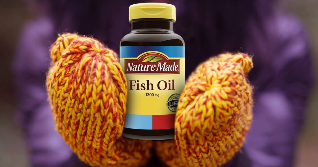 nature made fish oil held in mittens