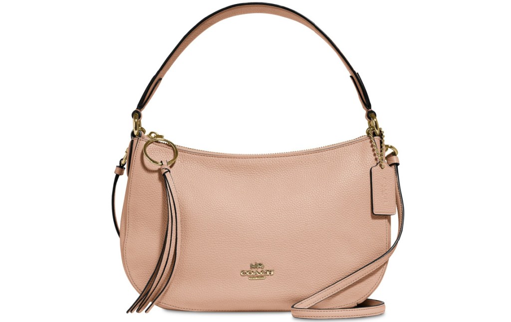 blush pink handbag with Coach monogram on front