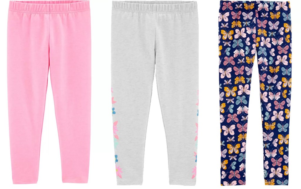 three pairs of Carter's girls leggings in solid pink, grey with flowers, and butterfly print