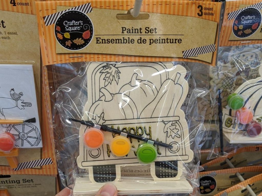 mini wooden paint set shaped like a vintage truck with pumkins in the back 