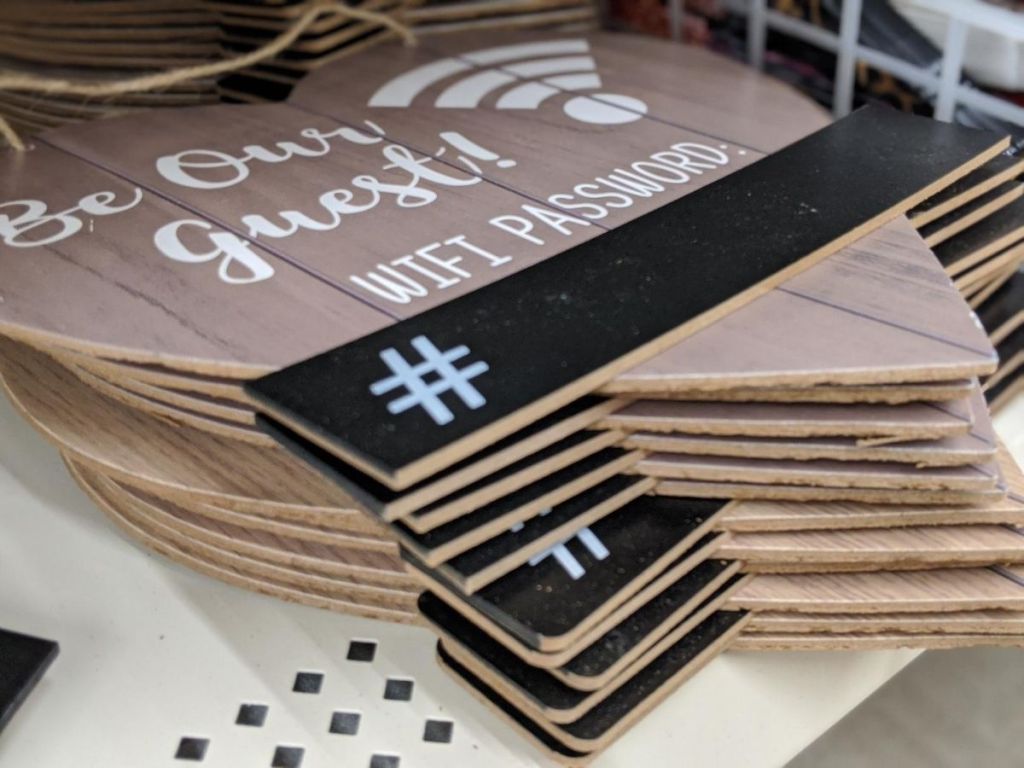 stack of heart shaped wooden signs on self at store