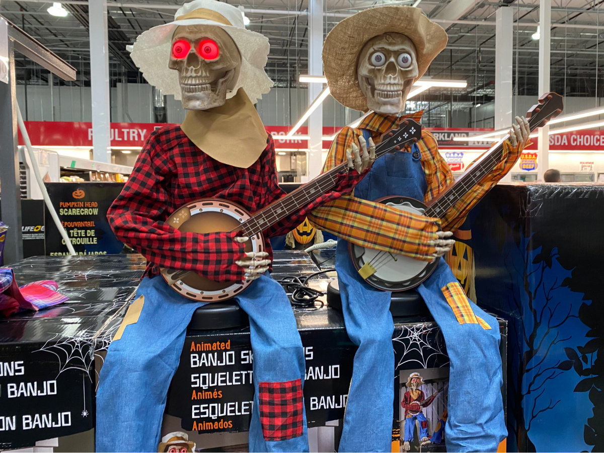 animated skeletons playing banjos sitting on boxes in store