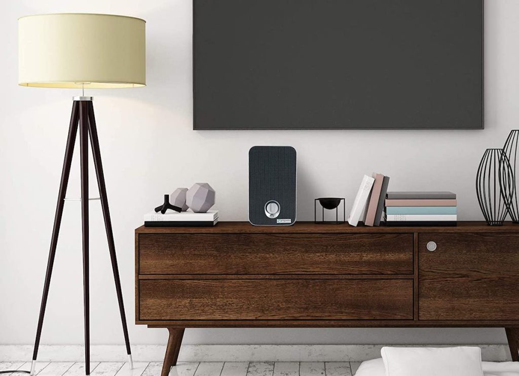 living room with TV, entertainment center and lamp