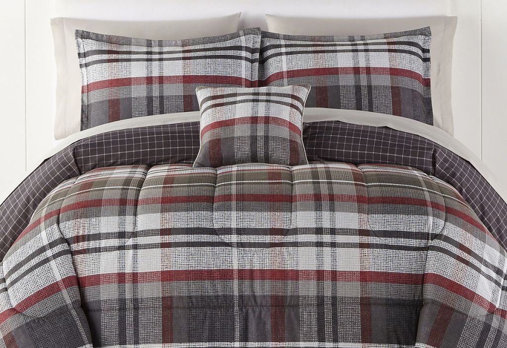 plaid bedding and pillows on a bed