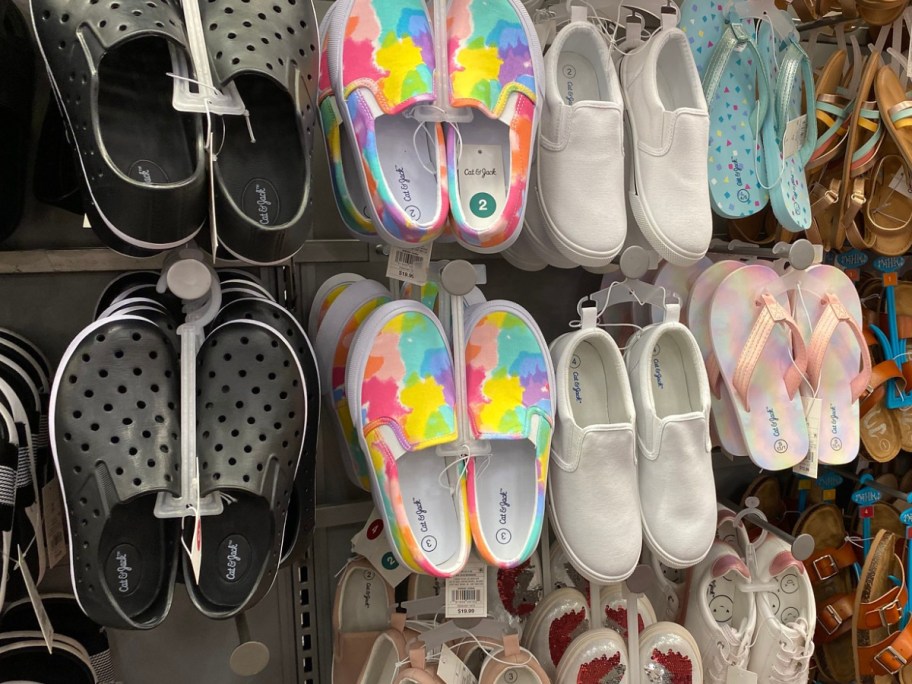 boys and girls shoes hanging on a rack in-store at target