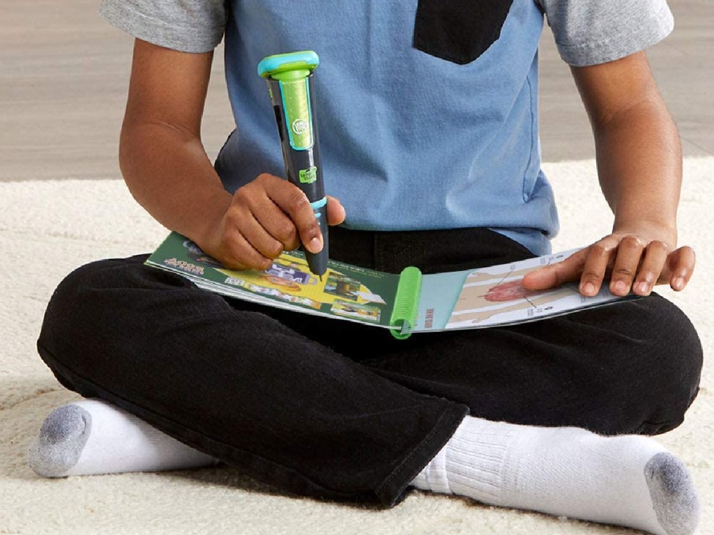 boy using LeapFrog LeapStart Go System