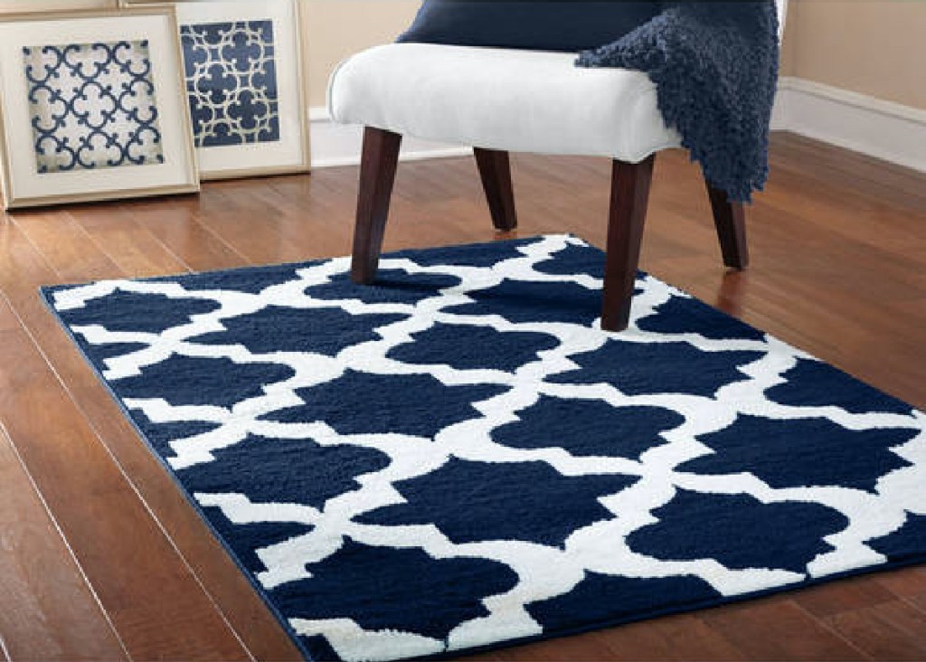 blue and white geometric area rug in home