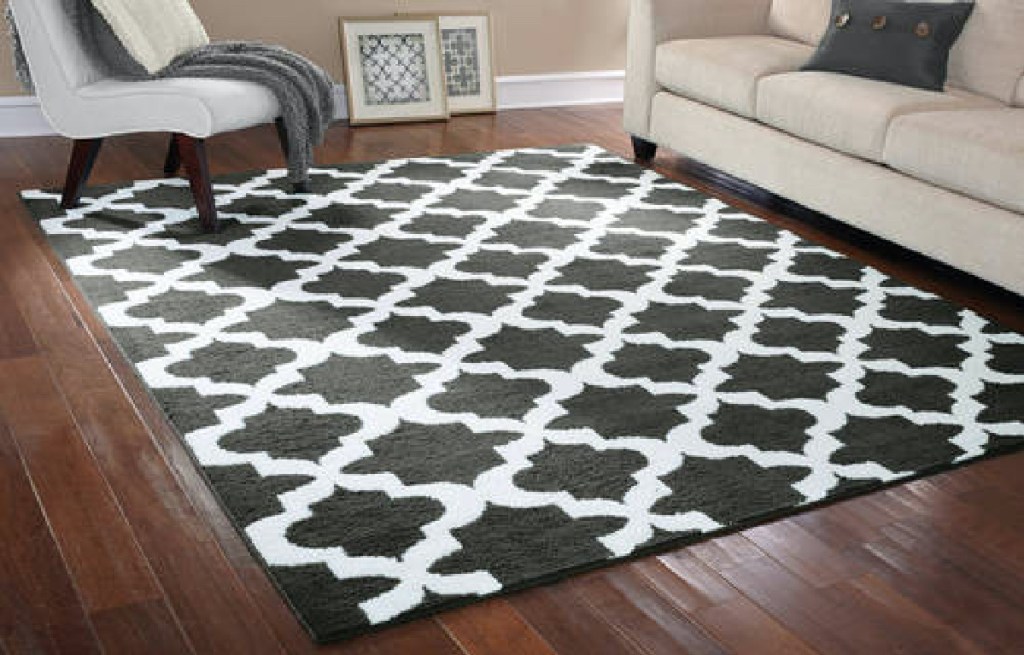 grey and white geometric area rug in living room