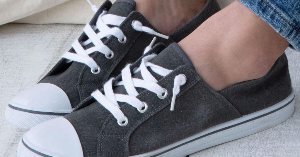 woman wearing canvas sneakers