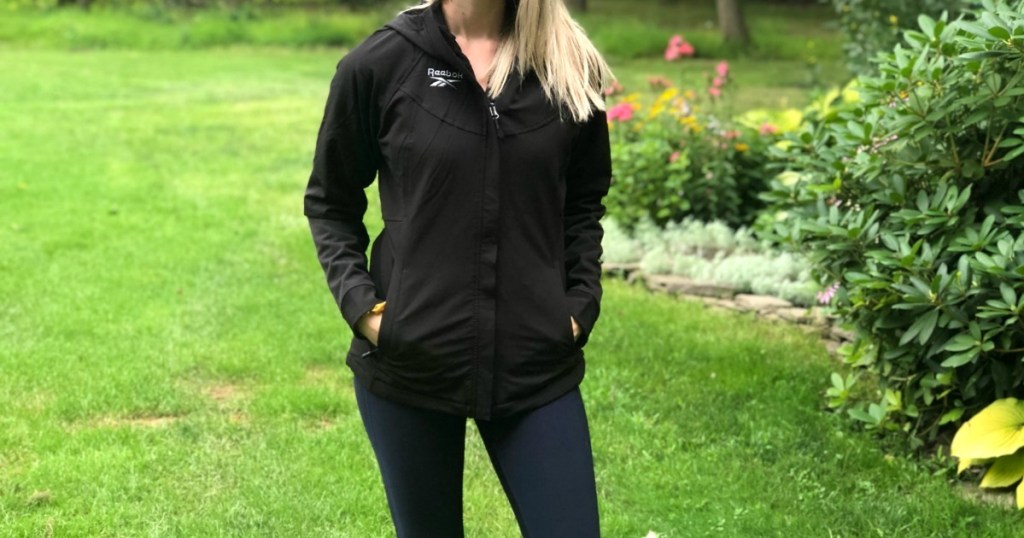 woman wearing black reebok jacket