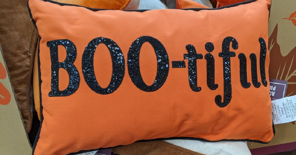 orange pillow with words, 'boo-tiful' on it