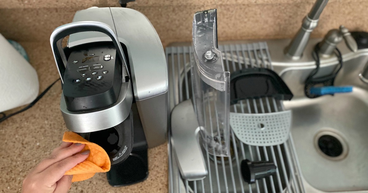 cleaning off a Keurig with a damp rag