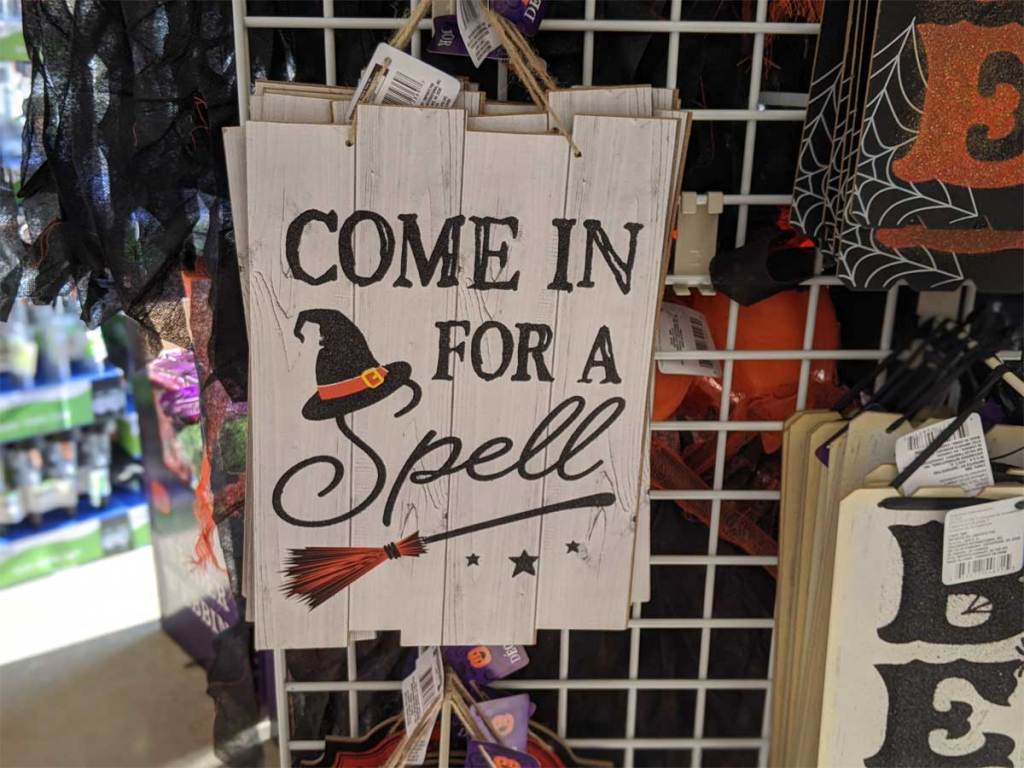Halloween decoration sign hanging in a dollar tree