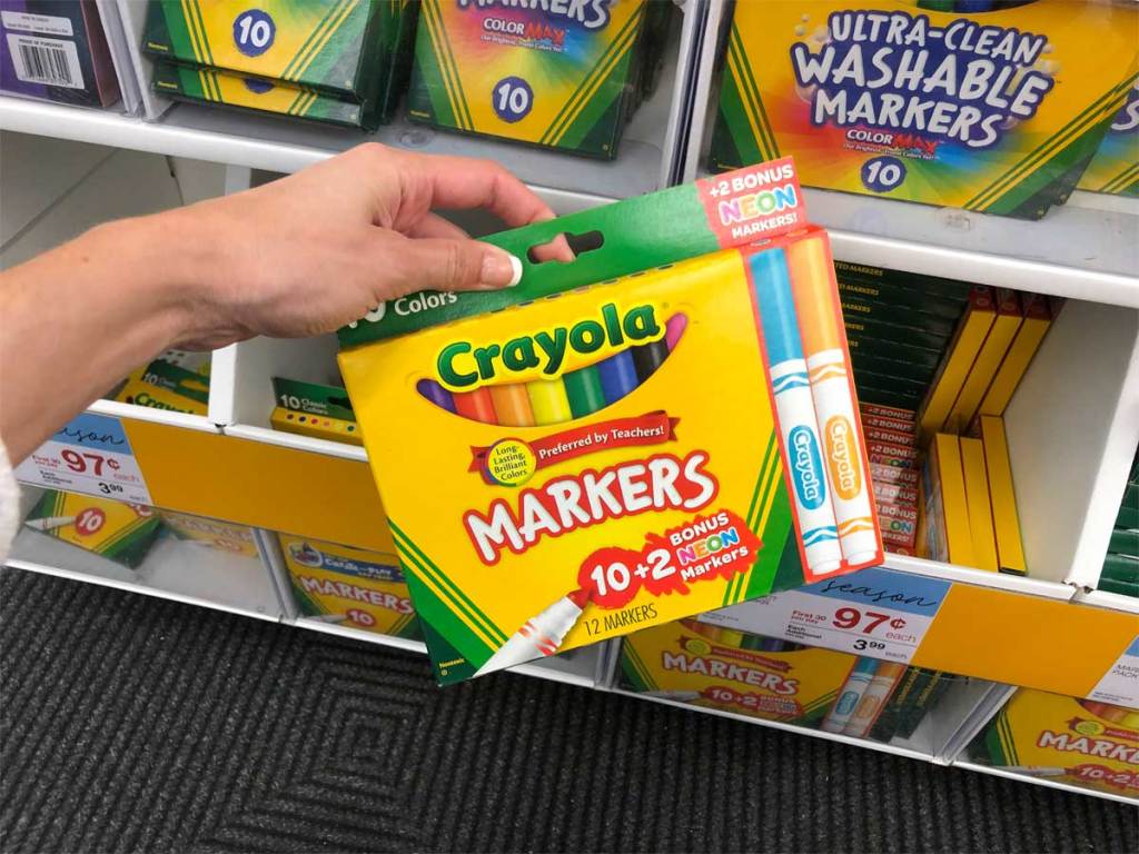 hand holding package of Crayola markers
