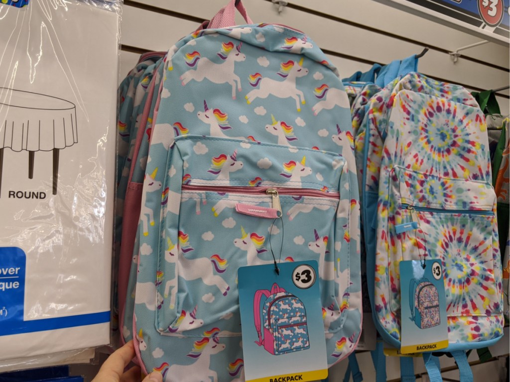 unicorn backpack and tie die backpack hanging in store