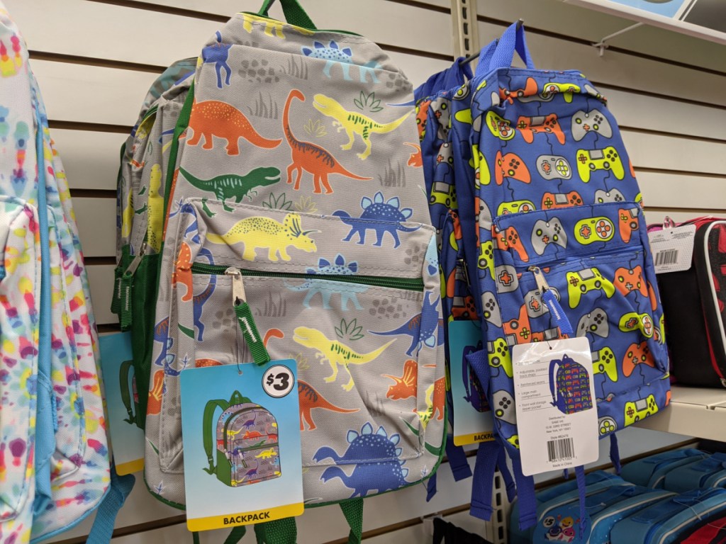 dinosaur backpack and video game controls backpack