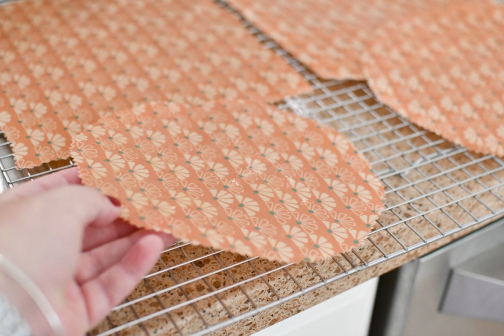 drying wax fabric wraps on a cookie sheet