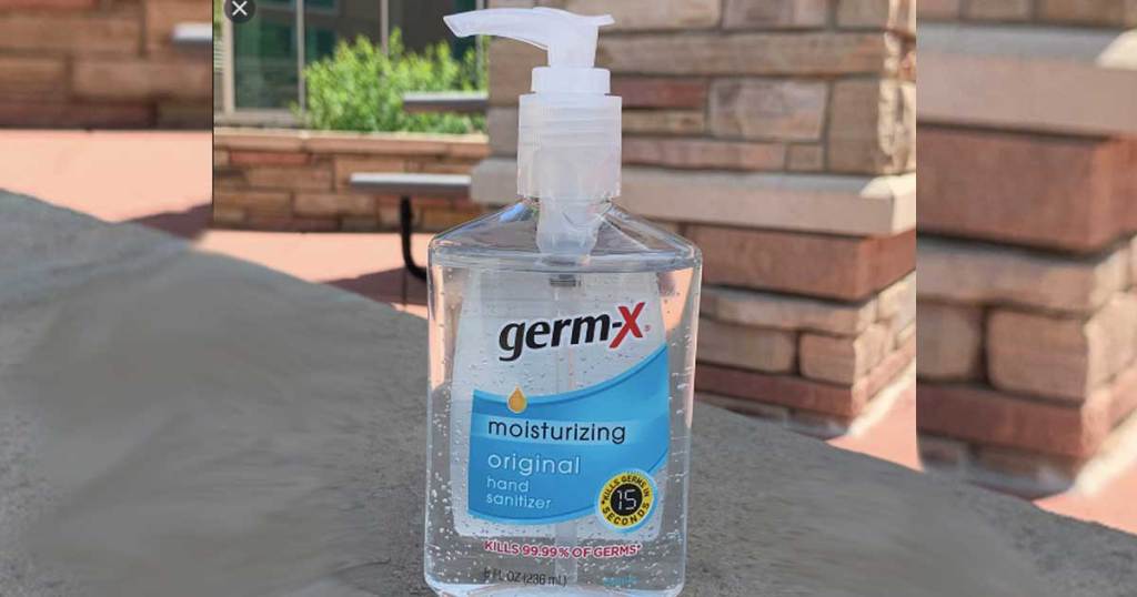 bottle of hand sanitizer on outside table