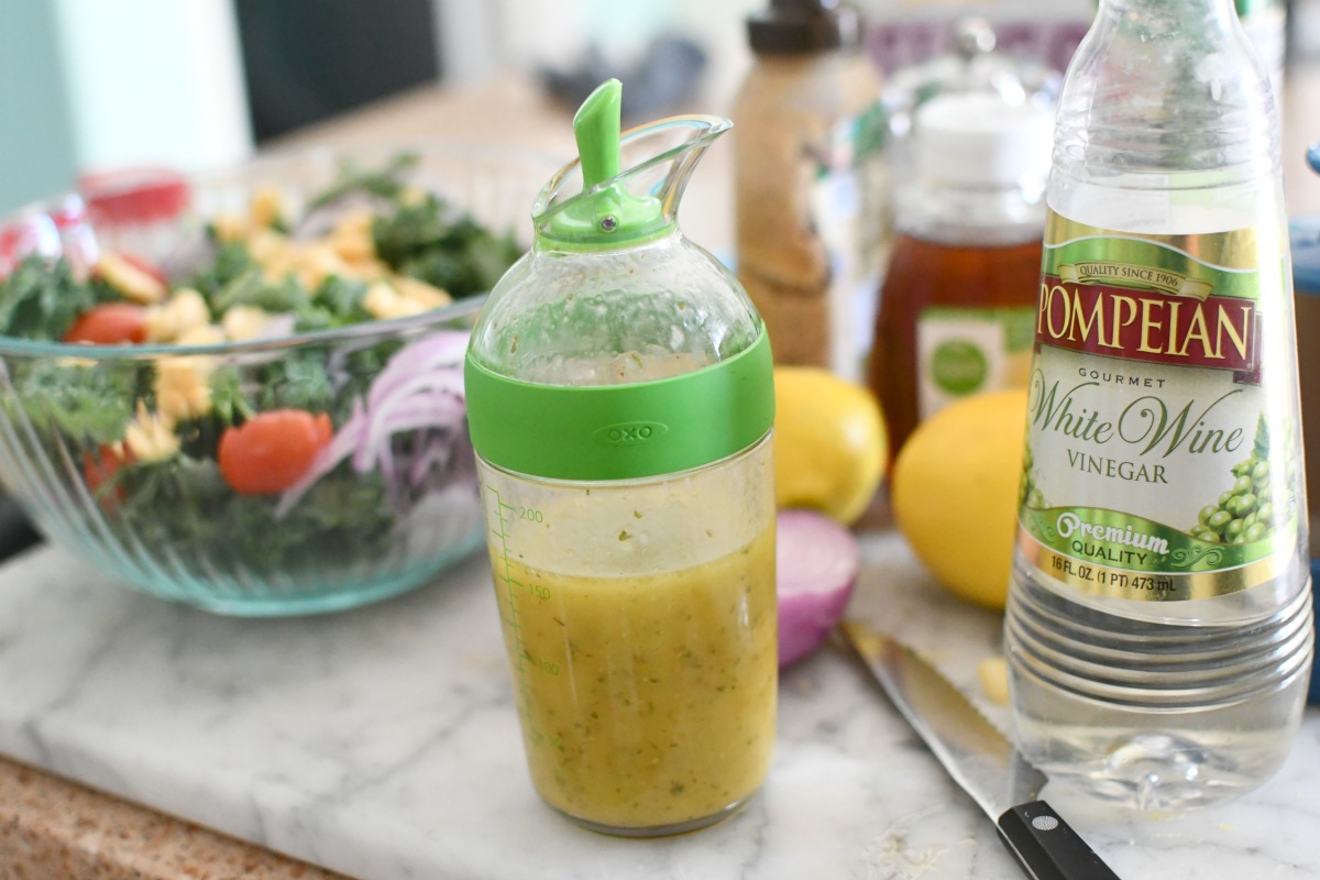 good grips salad shaker on the counter with dressing ingredients