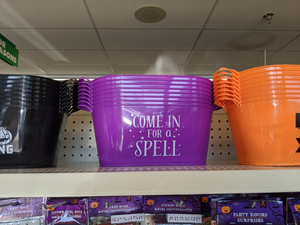 plastic buckets with handles with halloween decor on them