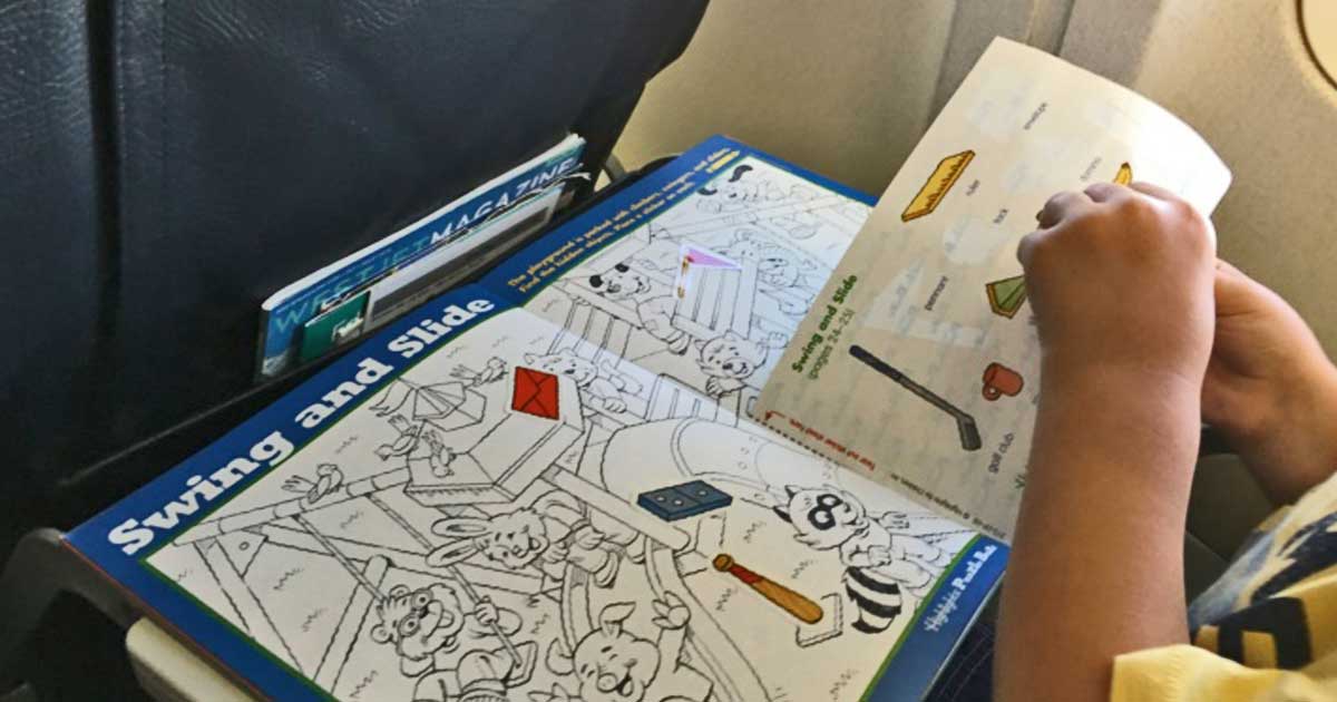 boy playing with hidden picture book