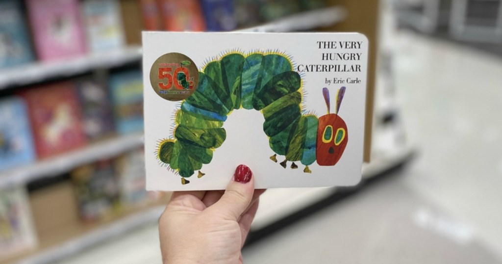 hand holding the very hungry caterpillar