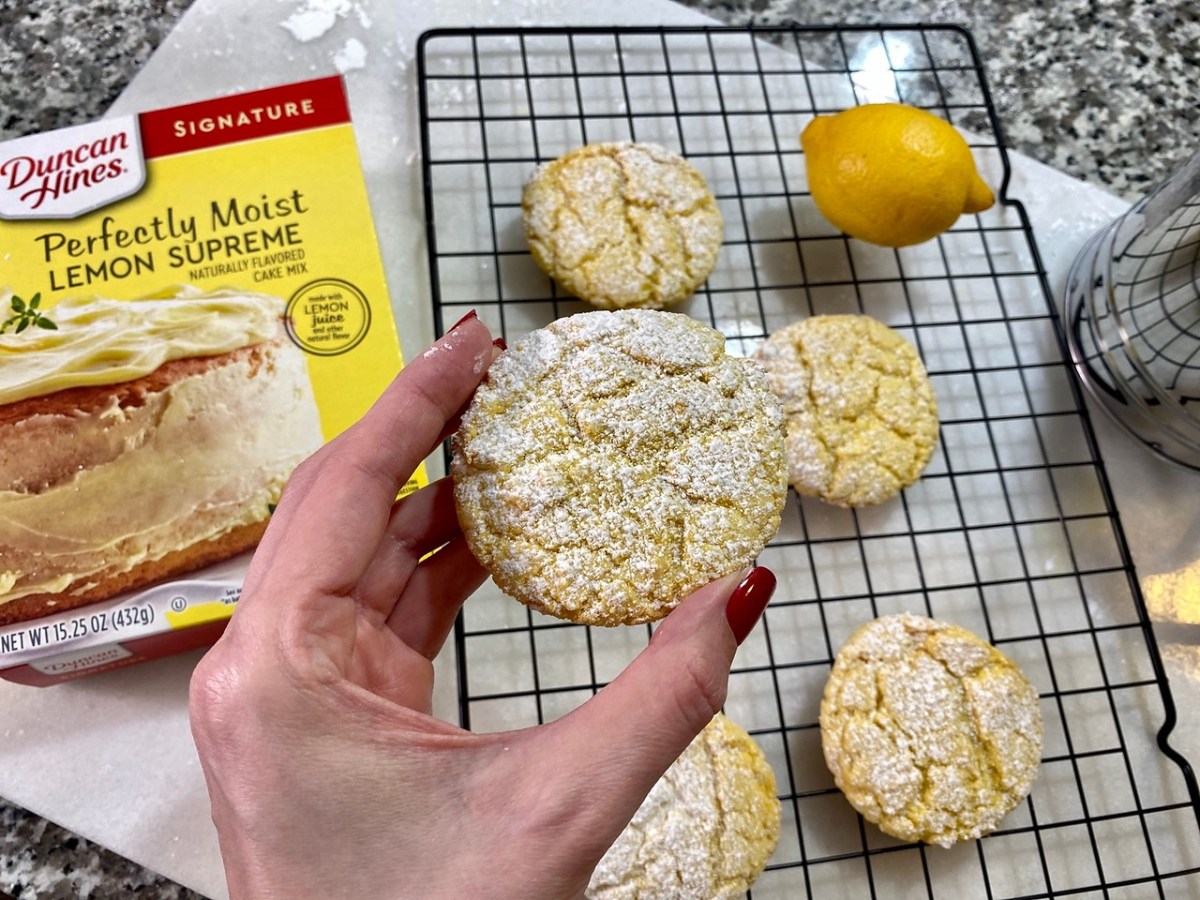 hand holding a lemon cakebox cookie