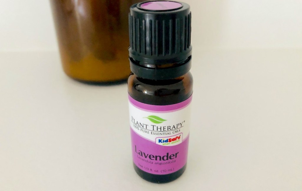 bottle of lavender essential oils sitting on counter