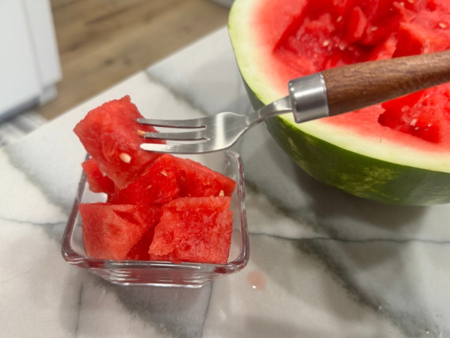 fork with watermelon cube on the end