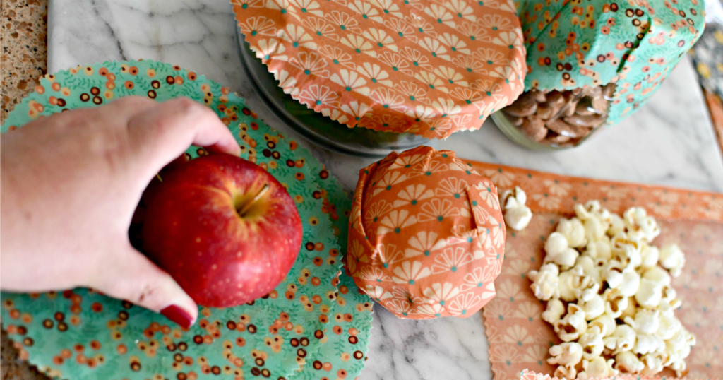 wrapping an apple with a beeswax food wrap