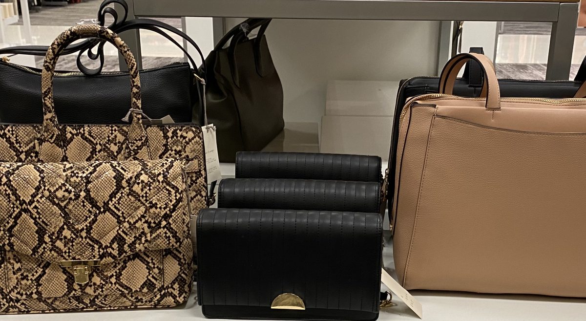 handbags on display table in store