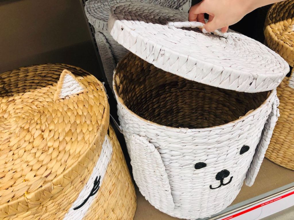 hand lifting lid on Animal Basket at ALDI