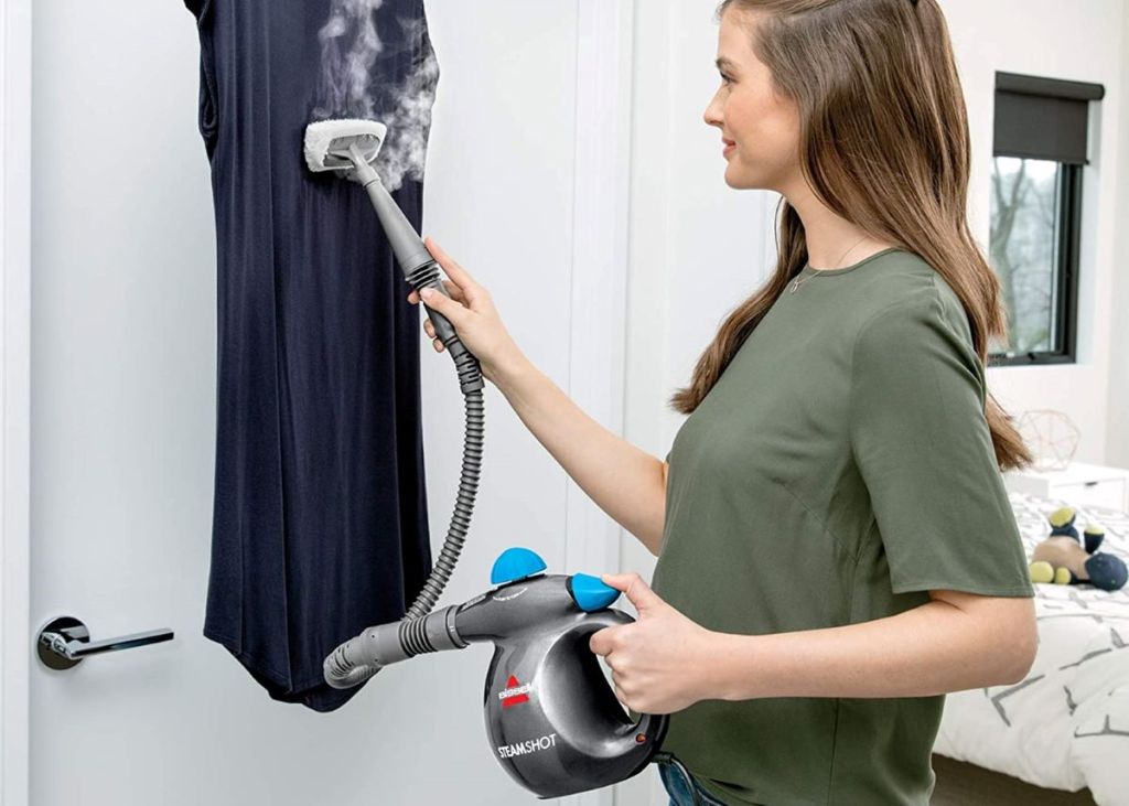 woman steaming a shirt