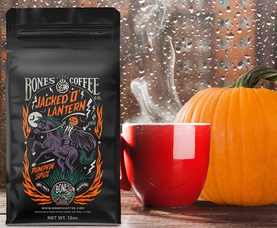 bag of coffee next to a pumpkin