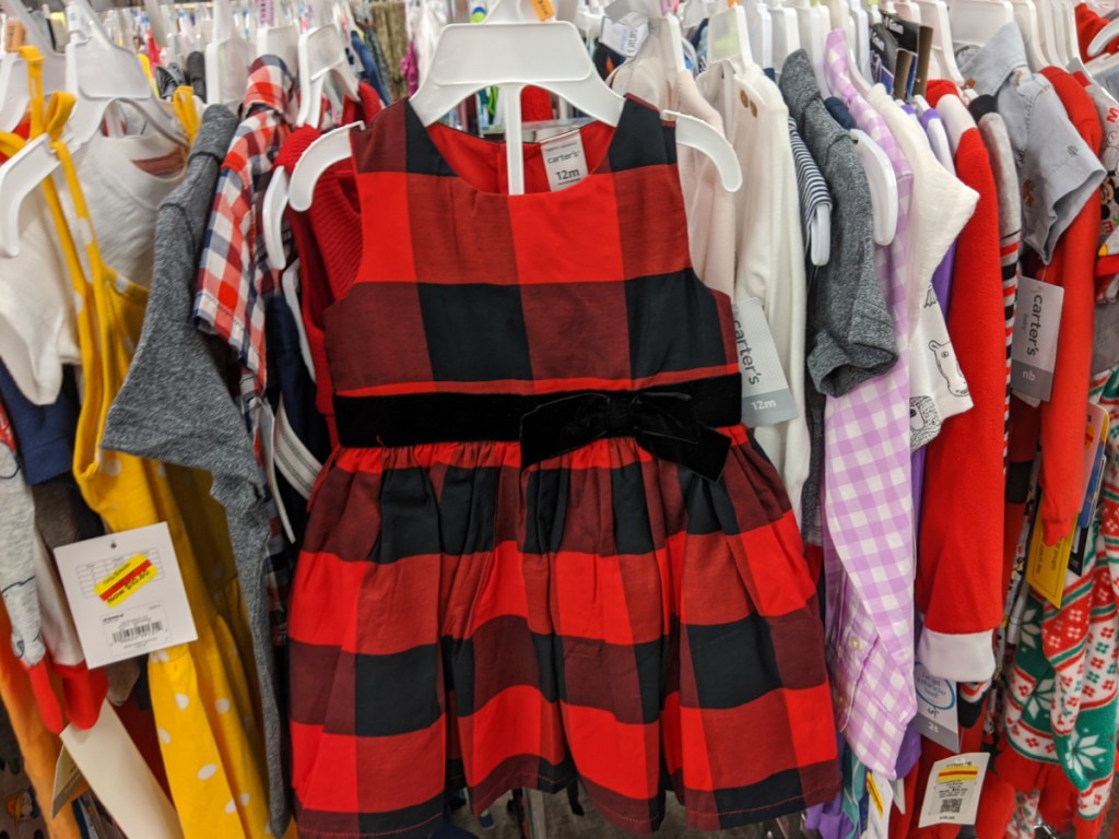 baby girls red and black buffalo check dress hanging in store