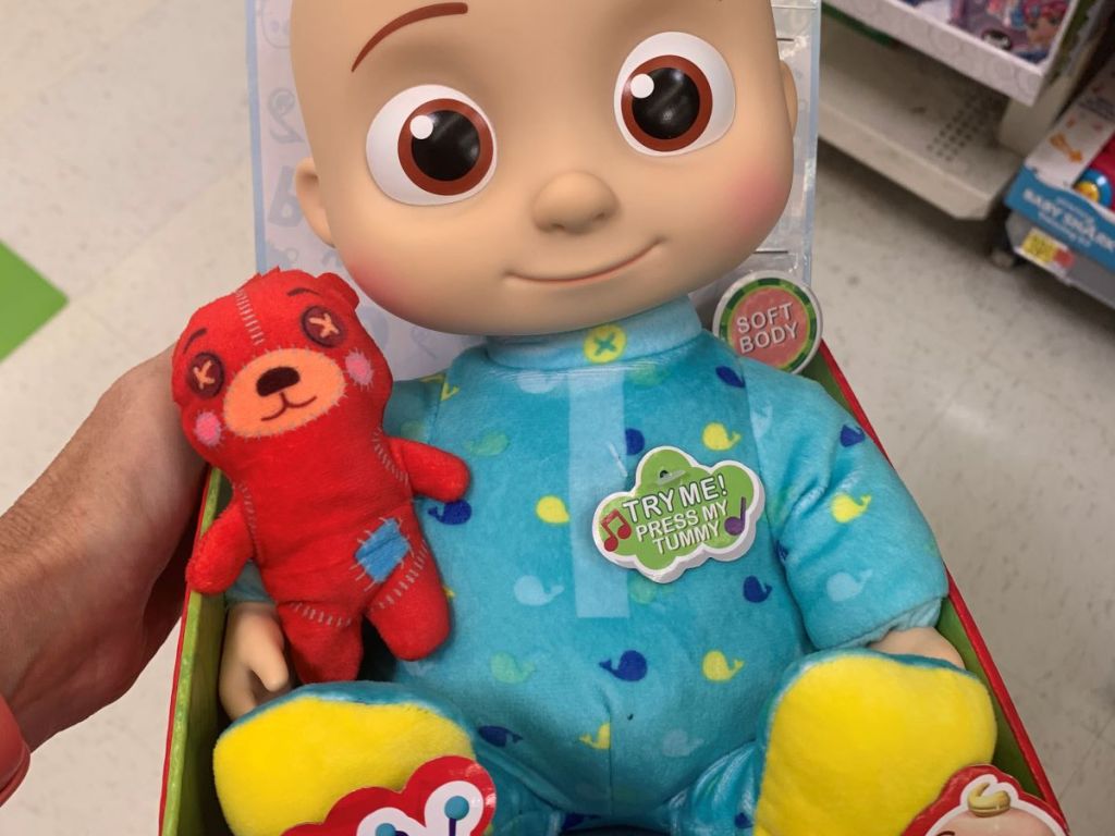 hand holding a Cocomelon Musical Bedtime JJ Doll