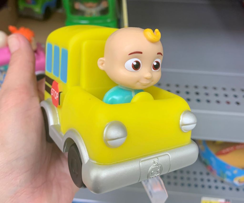 hand holding a mini car toy