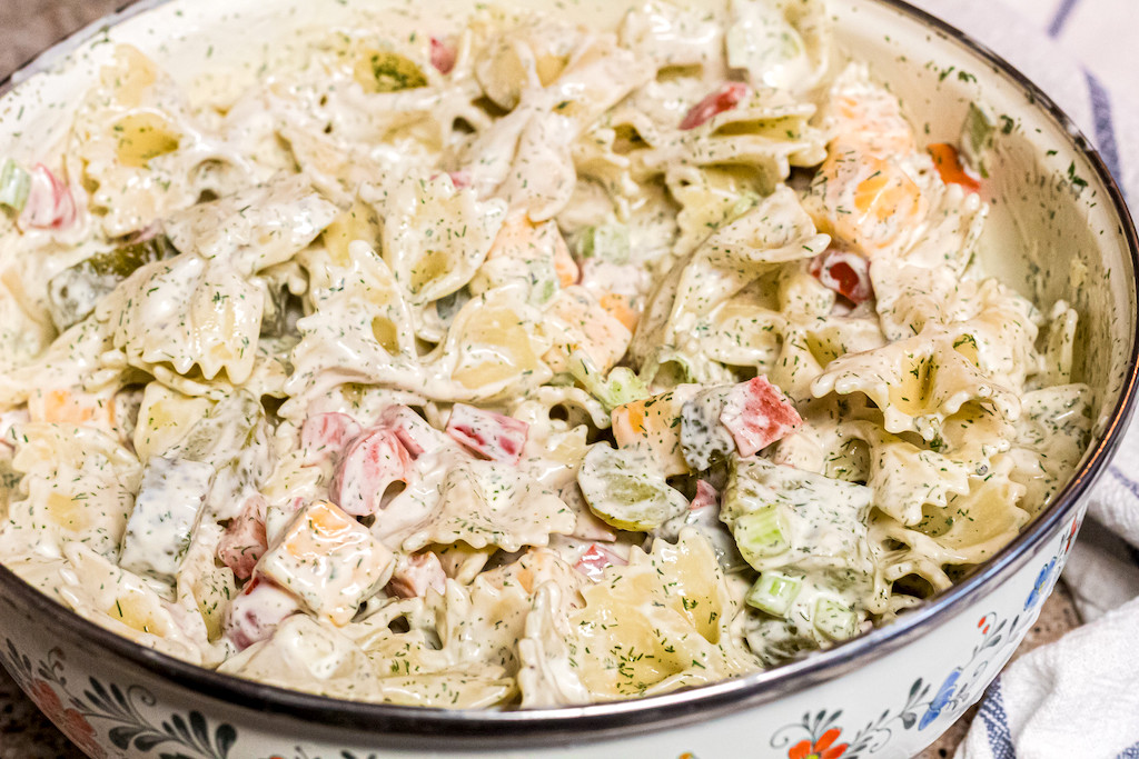 dill pickle pasta salad in large serving bowl 