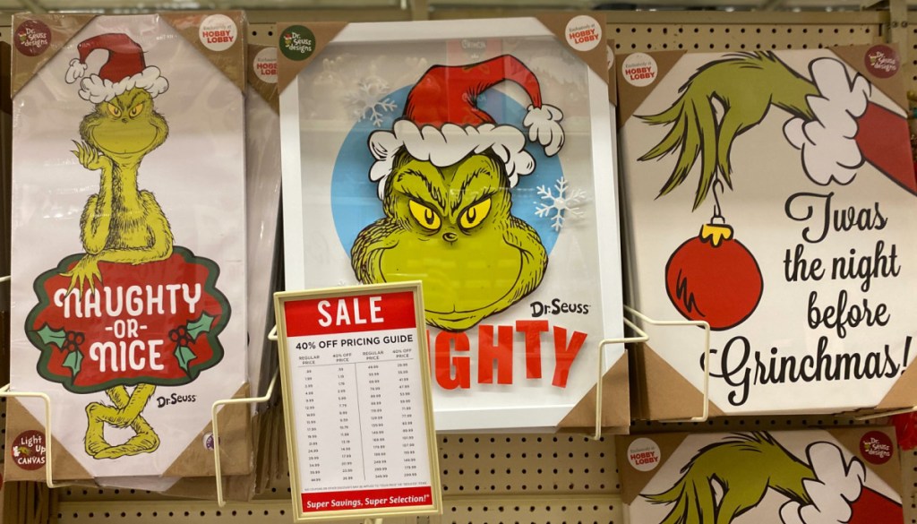 three Grinch wall decor in store