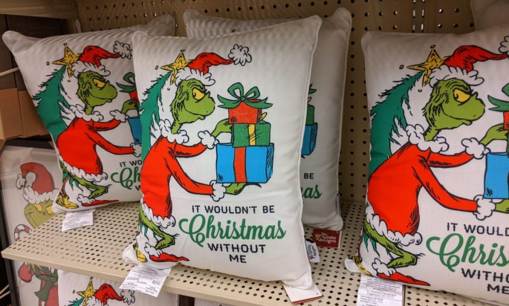 Grinch Christmas pillows on store shelf