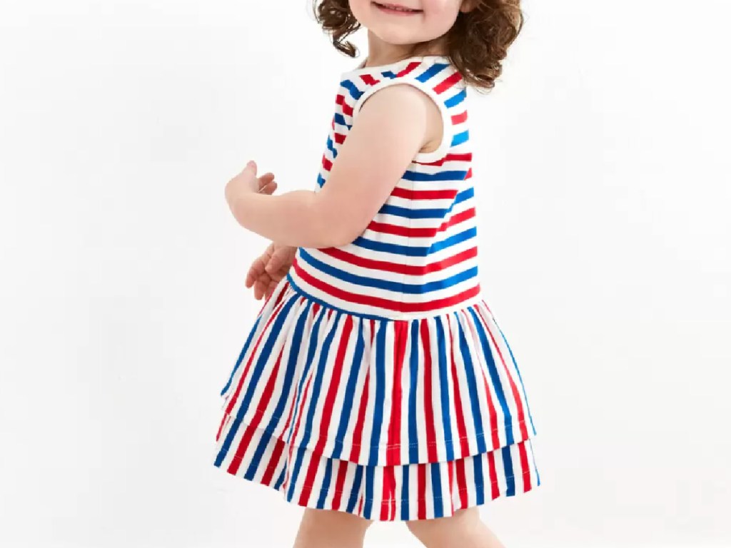 little girl wearing a red, white and blue ruffle dress