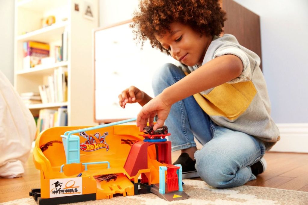 Boy playing with Hot Wheels Skate Park